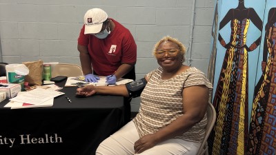 Woman having blood pressure taken