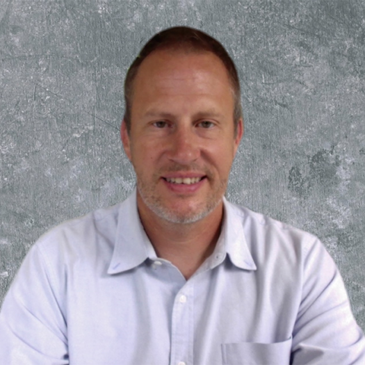 Brian Overholser poses for his headshot.