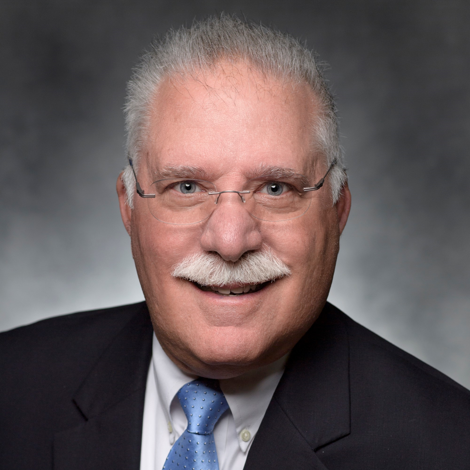 Dennis Savaiano smiles in his headshot.
