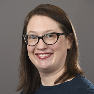 Susan Conroy smiles in her headshot.