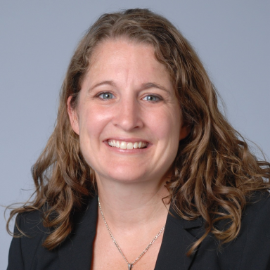 Laura Ruhl smiles in her headshot.