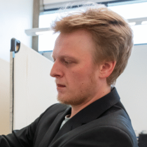 Mark Woollam is photographed in profile.