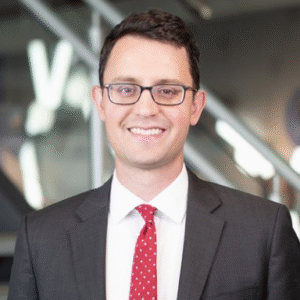 Tarik Yuce smiles in his headshot.